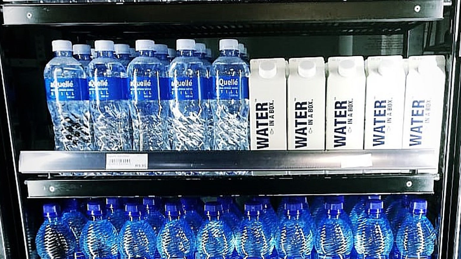 White Water In A Box cartons on a forecourt fridge shelf
